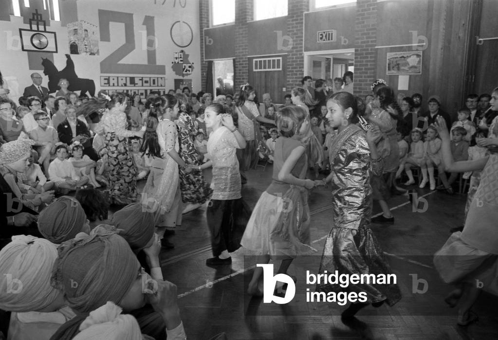 May Day celebrations took on an international flavour at the Earlsdon Methodist Church Hall, Coventry. Indian, West Indian, Pakistani, Irish and English children took part in an afternoon of dancing and music, 2nd May 1970 (b/w photo)