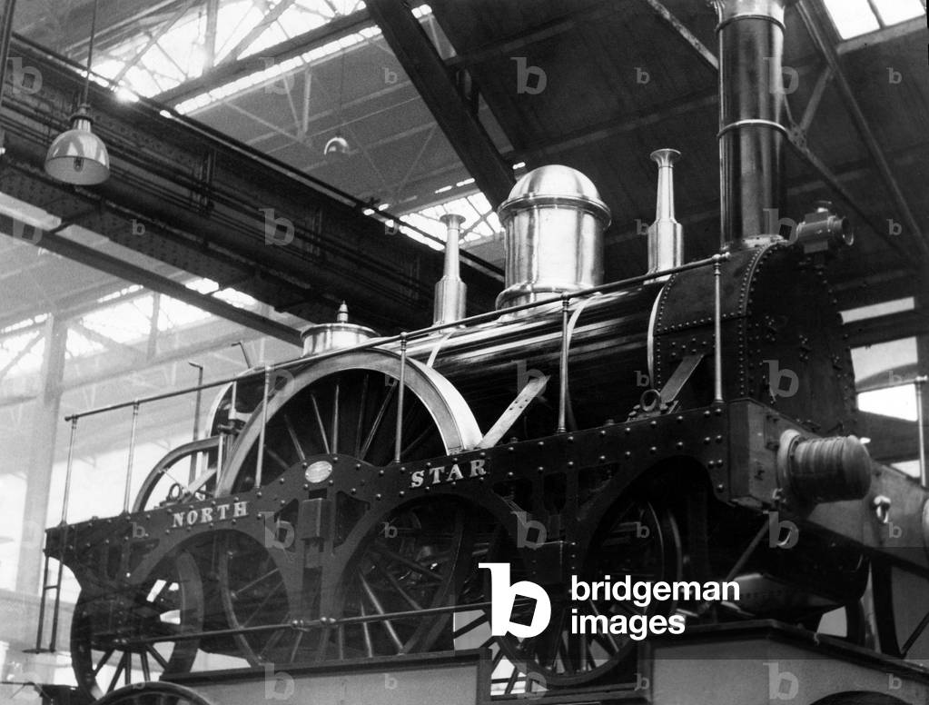 The Great Western Railway (GWR) Star Class North Star steam locomotive built by Robert Louis Stephenson in 1837, on display in Swindon. March 1960 (b/w photo)
