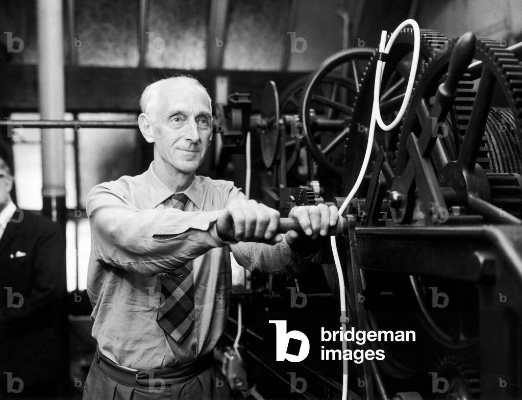 Wilfred Cripps winds the handle of the clock at St Paul's Cathedral - 935 times - on his last day at the Cathedral. 15th July 1969