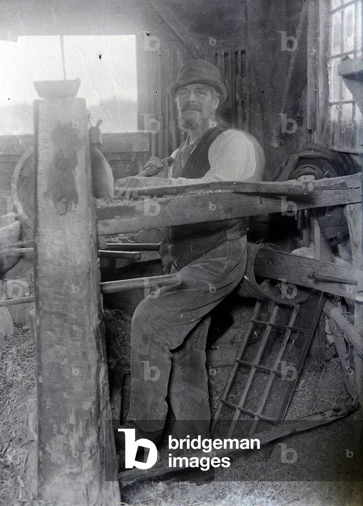 George Lailey, the old bowl turner of Bucklebury who turns bowls from elm logs on a primitive foot lathe 1922