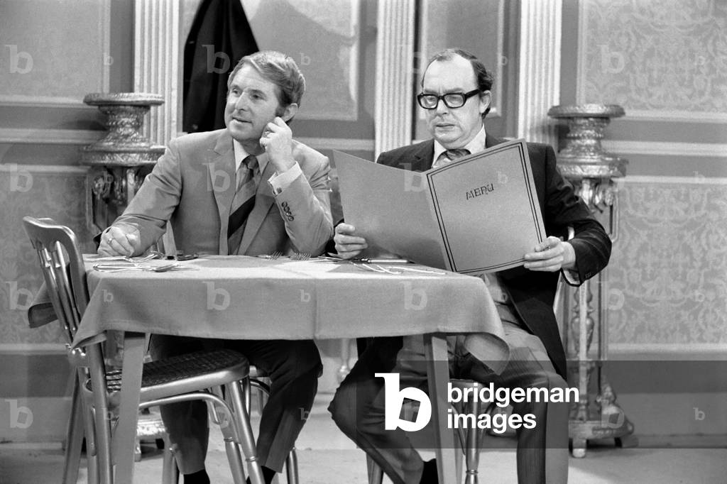 Eric Morecambe and Ernie Wise during rehearsals for their show. The sketch is one in a restaurant where the two boys try to get Susan Hampshire to be in their show. December 1969