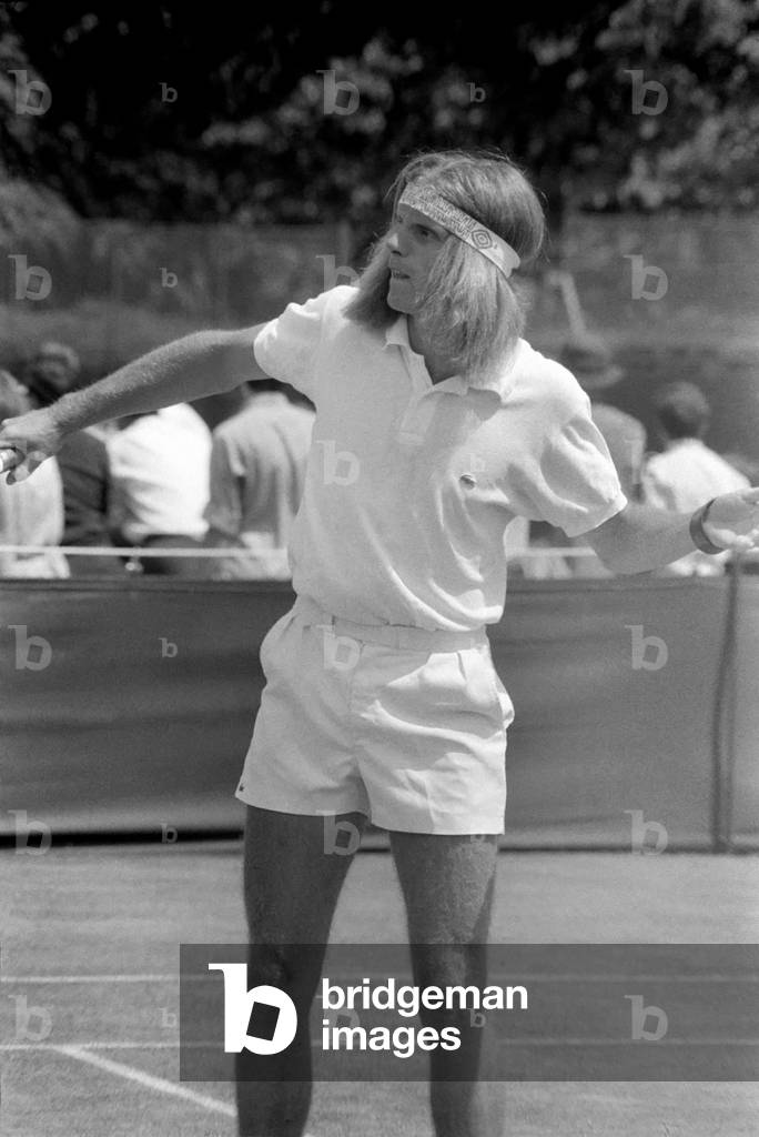 Wimbledon Tennis Championships 1970 1st Day. R.J. Moore (South Africa) complete with headband, in play against R.E. Homberg (U.S.A.) at Wimbledon today. June 1970