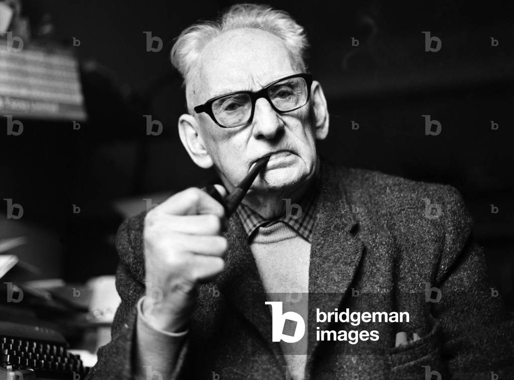 Elderly man smoking a pipe. December 1969