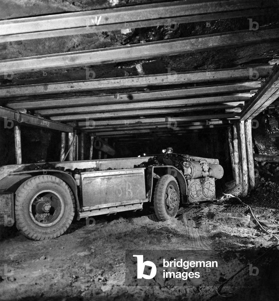 Mechanised mining. Powered by electric batteries, this shuttle-car is used to take coal from the coal-face to the conveyor belt. 1946