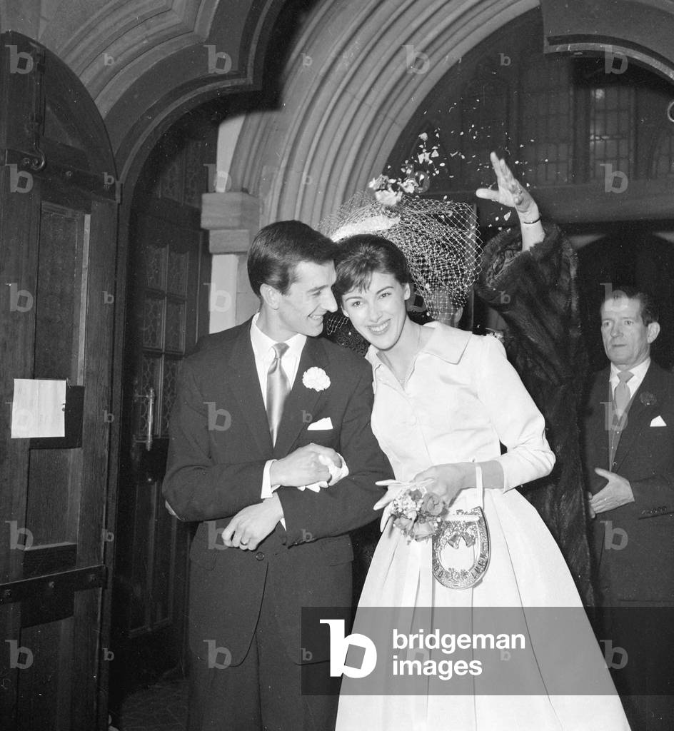 Actor Robin Ray, 25-year-old son of Ted Ray, gets married to actress Susan Stranks. The wedding took place at St. Gabriels Church in London SW1. January 1960 (b/w photo)