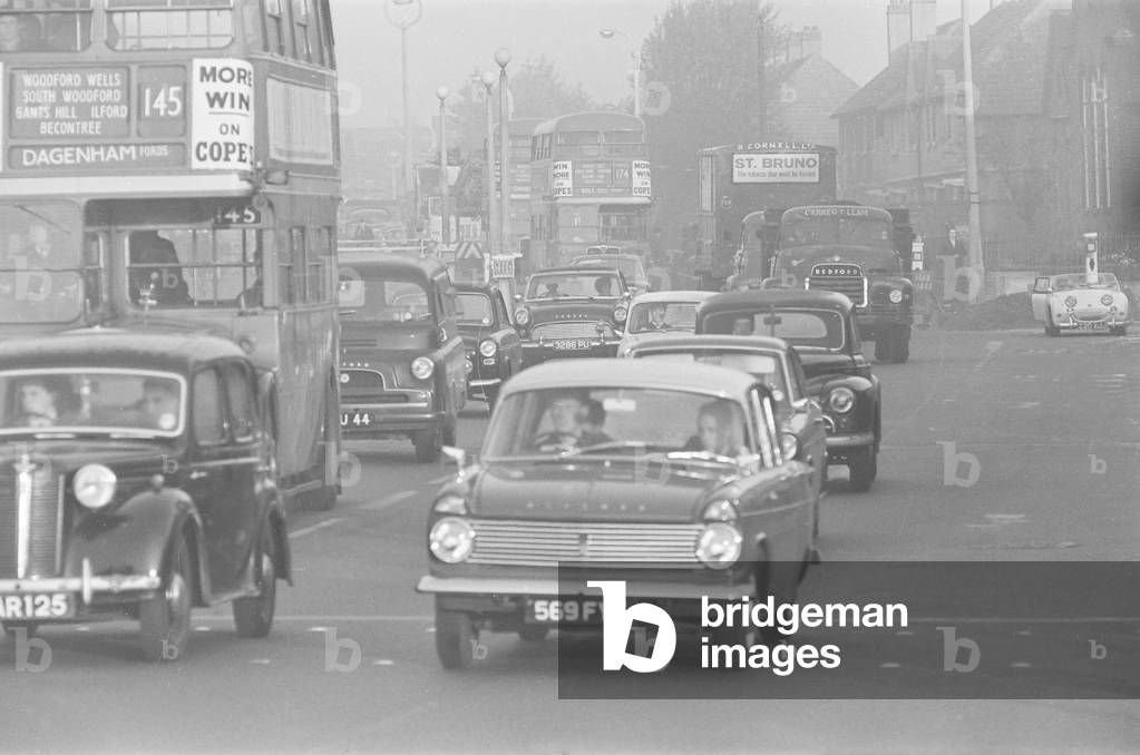 Traffic in High Street Dagenham as the Ford factory turns out at the end of the day shift. 2nd October 1963 (b/w photo)