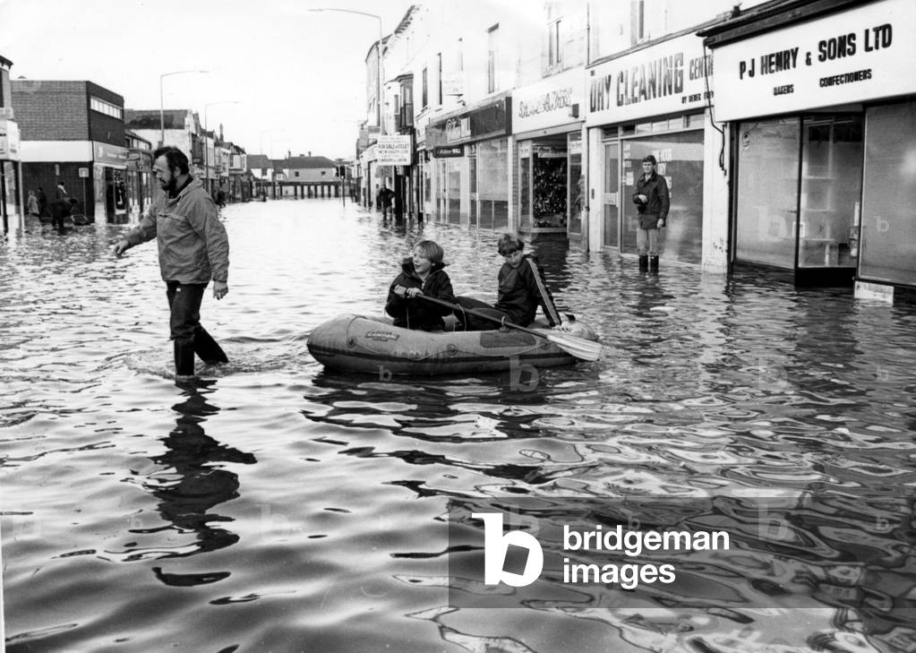 Cardiff - Floods - Boats are used to combat the flood waters in Cowbridge Road East - 27th Dec 1979 (b/w photo)