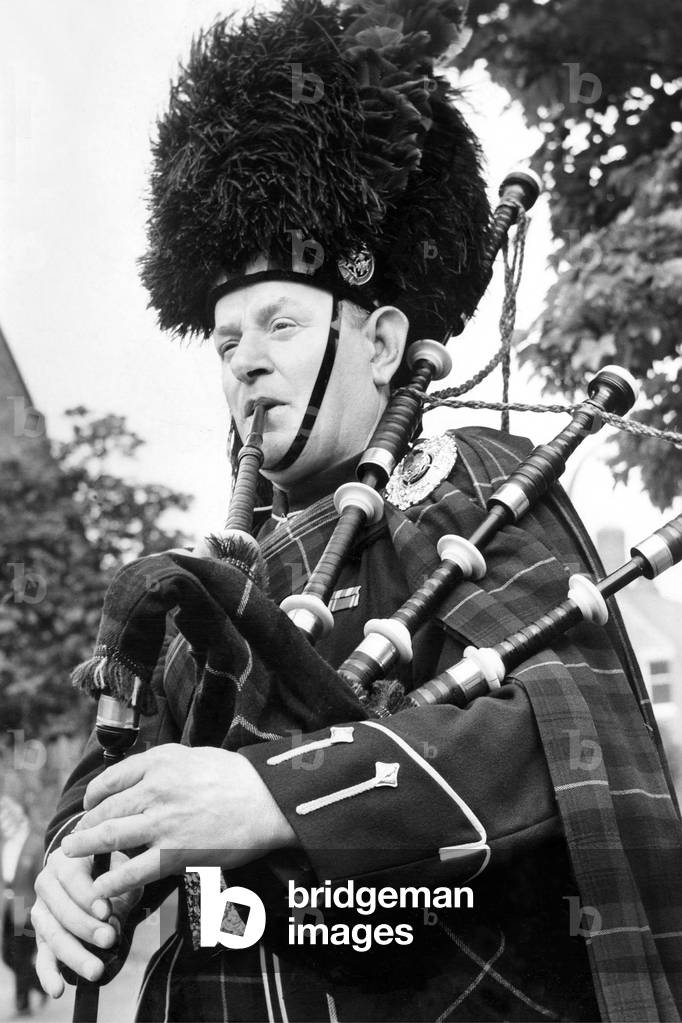 Bedlington Miners Picnic - Piper Jock Finlayson, of Morpeth Highland Pipe Band, makes an impressive figure as he tunes up for the picnic, 13 June 1970