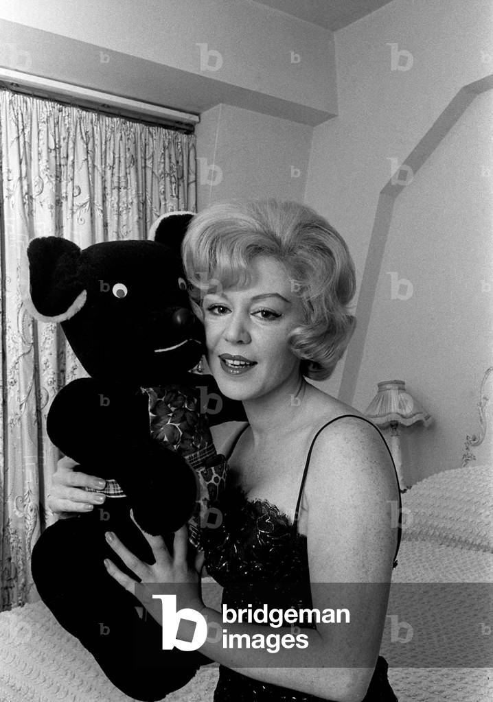 Singer Kathy Kirby singer holding a teddy bear.
14th January 1964.