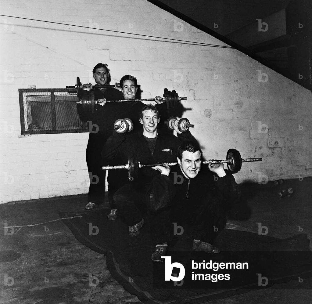 Denis Law training with his Huddersfield teammates before their upcoming FA Cup tie, 28th, January 1960 (b/w photo)
