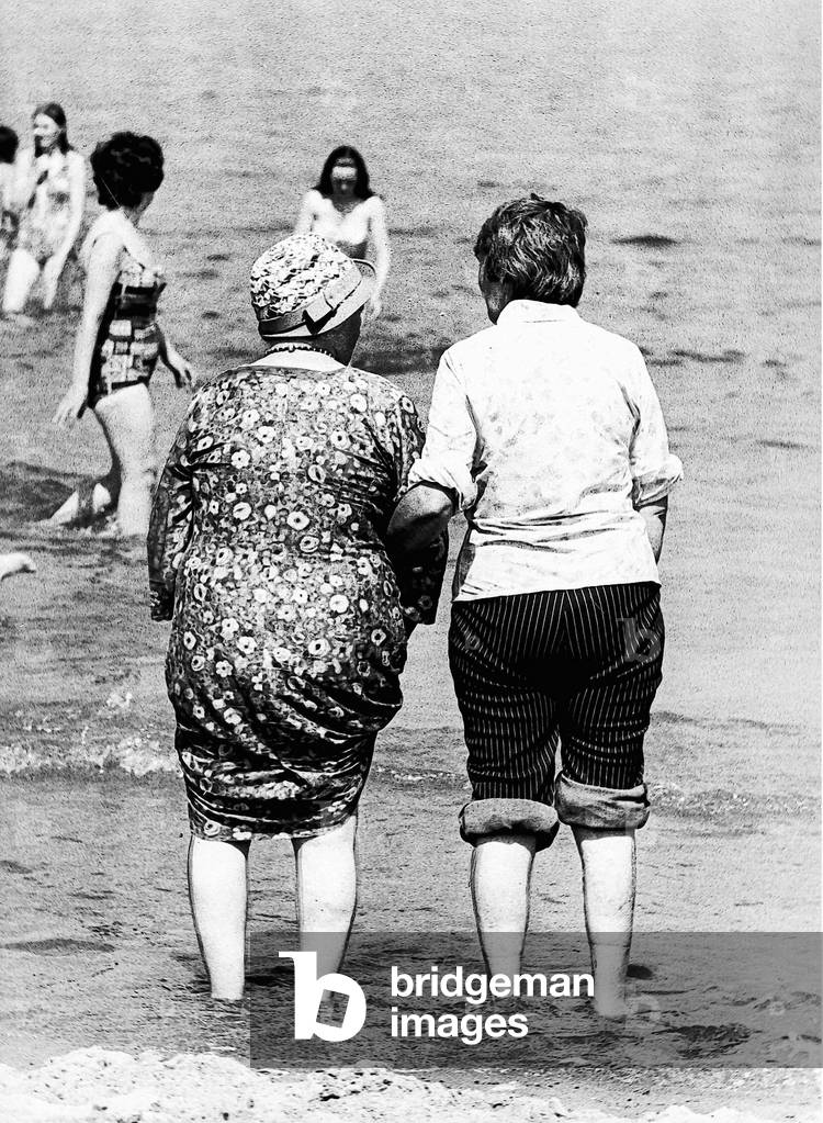 Two ladies plodge in the sea at Tynemouth in june 1976