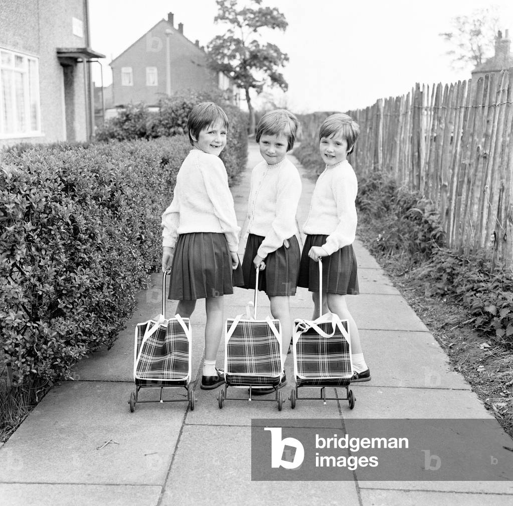 The Hatton triplets from Manchester, Deborah, Sharon and Allison now terrorising their teachers at school. 10th May 1968 (b/w photo)