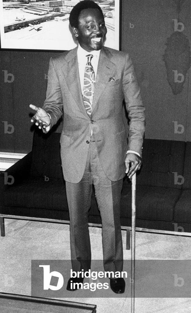 General Yakuba 'Jack' Gowon recently deposed president of Nigeria seen here on his arrival at Gatwick Airport. The General, who flew in from Accra, is to spend a two week holiday in Britain with his family who arrived here a few days before the coup, 13th August 1975 (b/w photo)