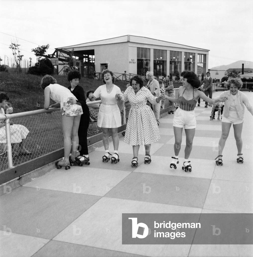 Bultins Holiday Pwllheli: Mrs. Nellie McGrail, Pools Winner. Horse riding/Boating/Elephant/Roller skating/Family. Now a ride the big wheel for Mrs. McGrail and Barbara. Roller skating. June 1960