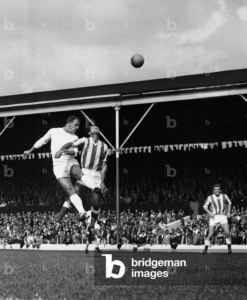 English League Division Two match at the Victoria Ground. Stoke City 0 v Leeds United 1. Leeds' John Charles jumps up for the high ball with Stoke's centre half Stuart. 18th August 1962 (photo)