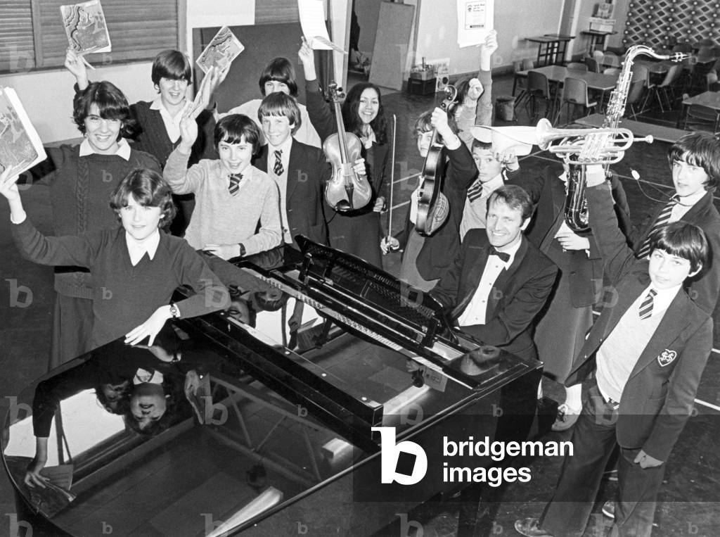 Mr Edward Murphy took music lessons at Sacred Heart RC Secondary School in Redcar. He accompanied the school choir and orchestra, and he had a thoroughly typical school dinner. In fact the only thing worth noting was that he played the piano continuously for 12 hours and raised £200 in sponsorship money. It was all part of the school bazaar which raised a total of £900 - more than enough to pay for the new computer which the school has on order. 14th July 1981 (b/w photo)