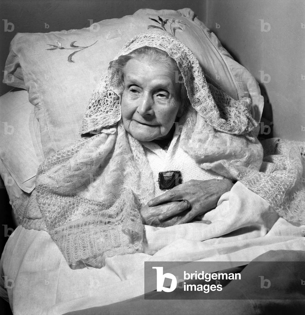 Mrs. Greenfield at home today she is looked after by her two daughters, 31st December 1952 (b/w photo)
