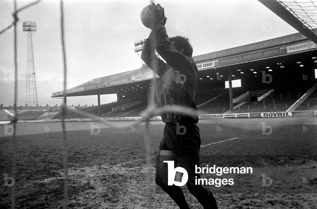 Long after the other Manchester City players have finished training, there are two still there. Malcolm Alison the Ass Manager, and Joe Corrigan the recognised first team goalkeeper. A mud spattered Corrigon being blasted from all angles by Malcolm Alison at Maine Road. November 1969 (photo)