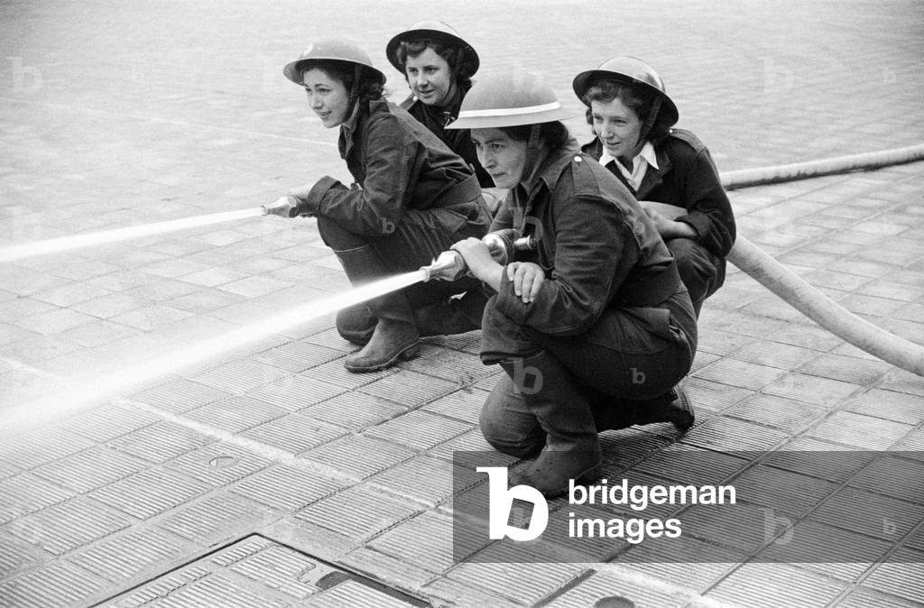 W.N.F.F - first pictures of Women's Fire Service Pump Crews - competition with the BBC Womens Crew at HQ London Fire Force, 17 June 1942 (b/w photo)