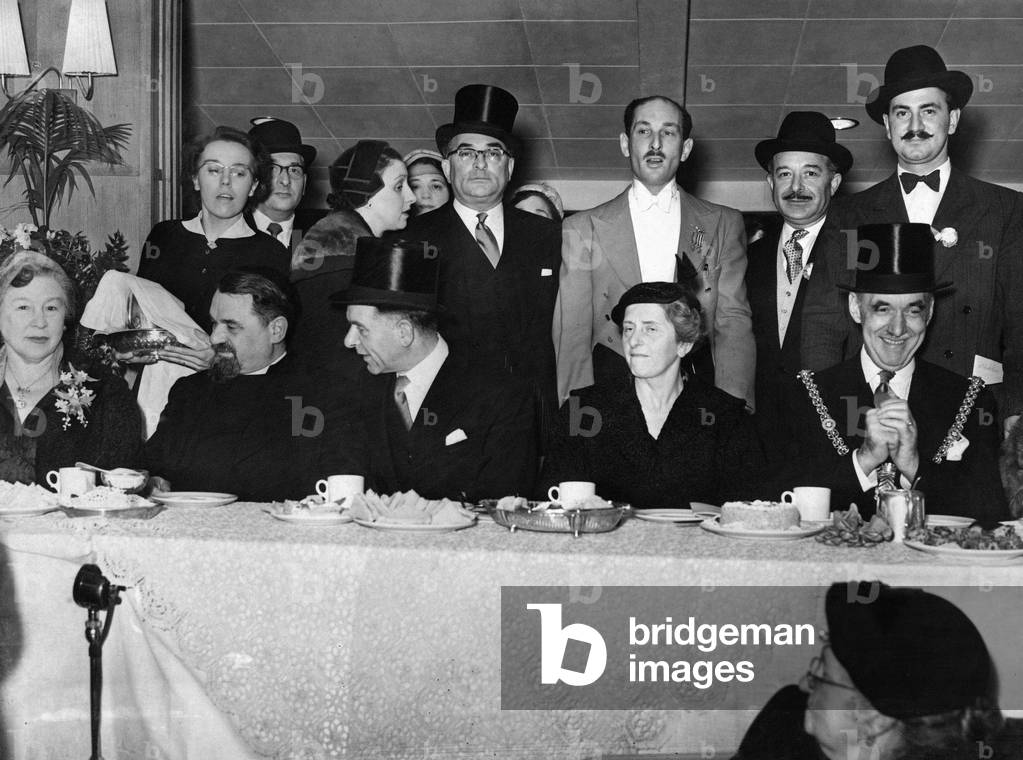 Some of the principal guests at the opening ceremony and consecration of the new Cardiff United synagogue at Tygwyn Road. Seated left to right are: Mrs Israel Brodie, Chief Rabbi of Great Britain and the Commonwealth Israel Brodie, President of the Synagogue Mr Gershon Cohen, Mrs Gershon Cohen, and the Lord Mayor Cardiff Alderman George Ferrier. January 1955 (b/w photo)