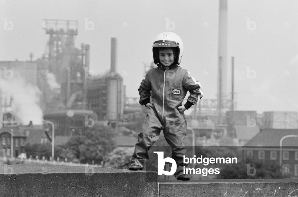 Four year old Jarno Barratt of Corby, Northamptonshire, in his motorcycle outfit which he wears when performing on his 50 cc Italjet motorbike, 10th June 1979 (b/w photo)