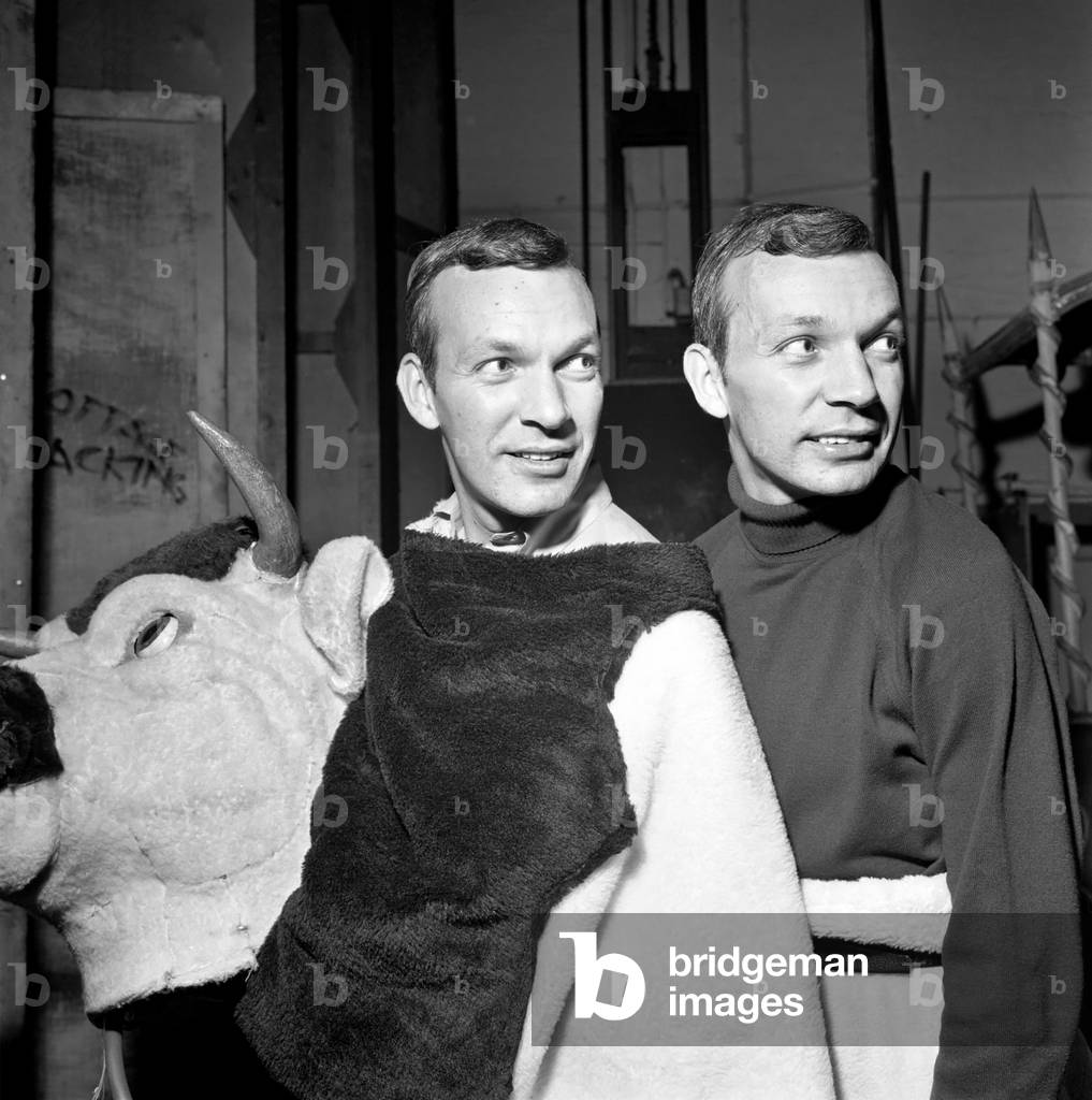 People are amazed when the head and rear end of the cow come off in the Palace Pantomime, 19th December 1969  (b/w photo)