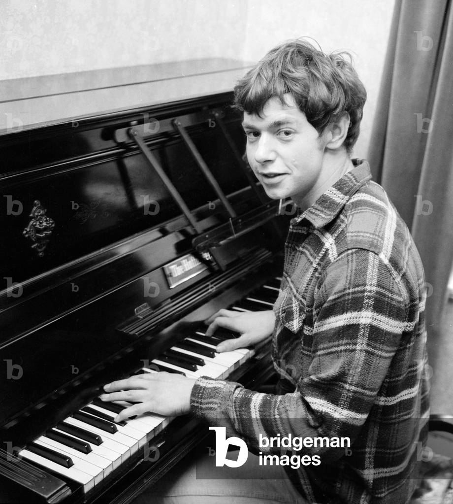 Singr Ian Whitcombe pictured at home on his piano. 11th March 1965 (b/w photo)