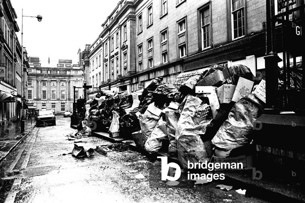 Rubbish piling up on the pavement of Shakespeare Street, Newcastle during the refuse collectors strike on 2nd March 1979 (b/w photo)