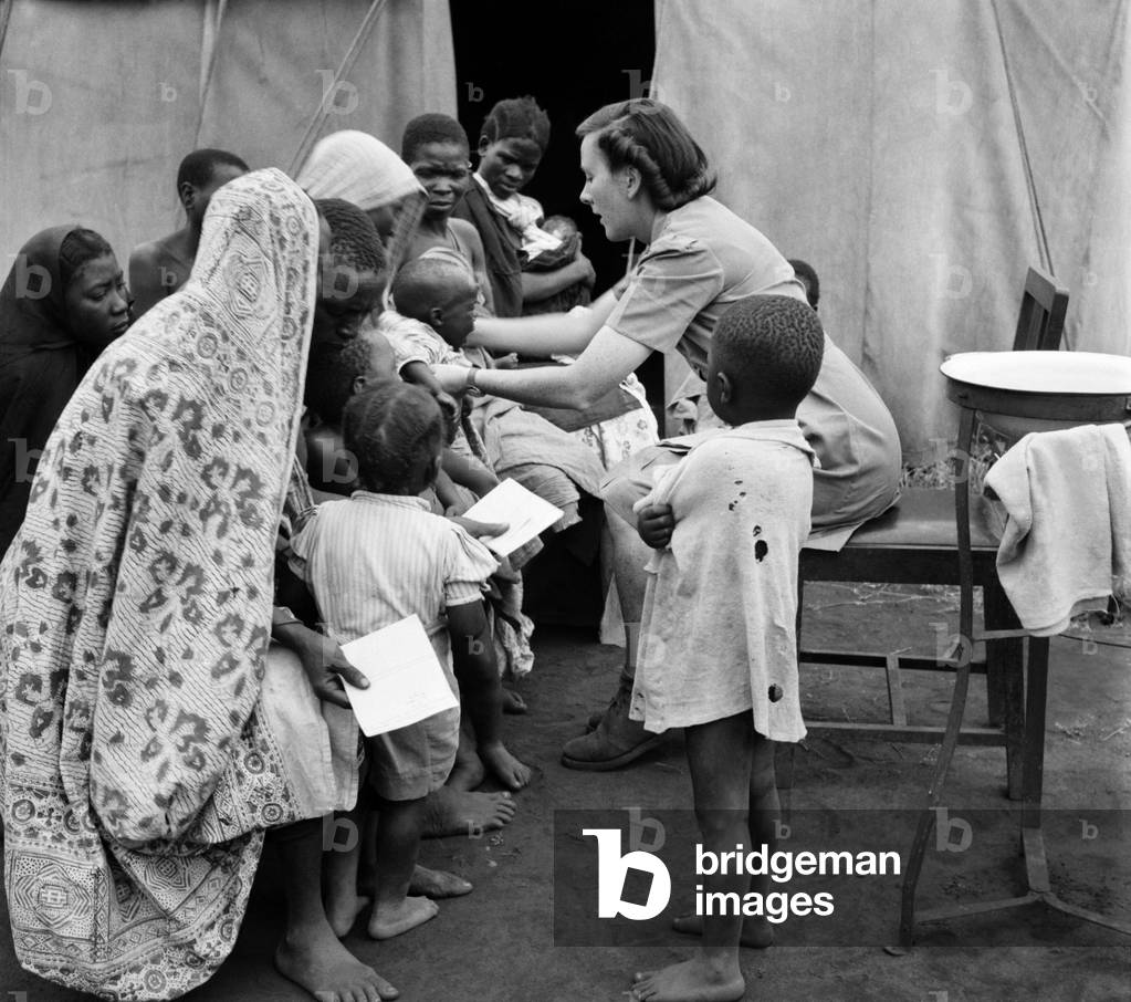East African groundnuts scheme. Open air hospital at Kongwa - Sister Helen Porter with native mothers and babies. May 1952 O15017
