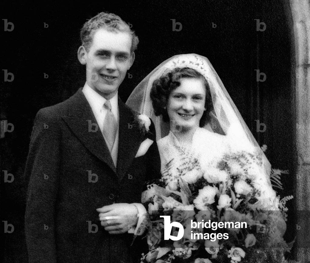 Douglas and Joan Hawkins from Moseley who are celebrating their 75th Wedding Anniversary, the couple on their wedding day at Old Edgbaston Church, 1939 (b/w photo)