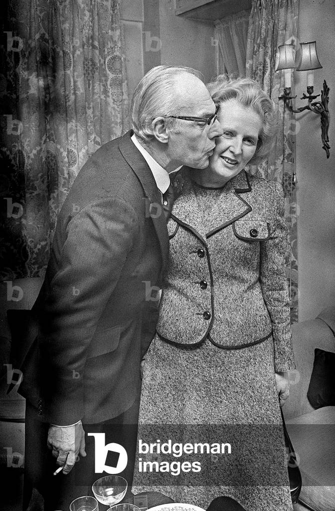 Margaret Thatcher with Denis Thatcher who kisses her on the cheek - February 1975.