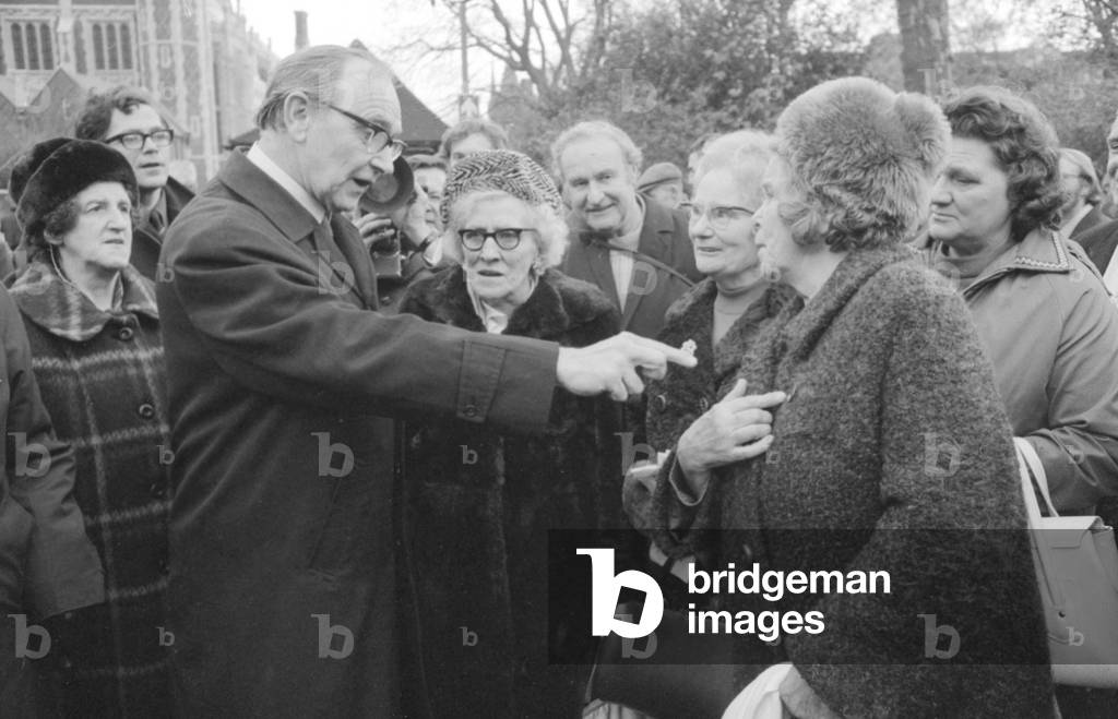 Jack Jones leader of the TGWU seen here talking to pensioners following a demonstration to increase the living conditions of the elderly in Lincoln Inns Fields, 22 November 1972