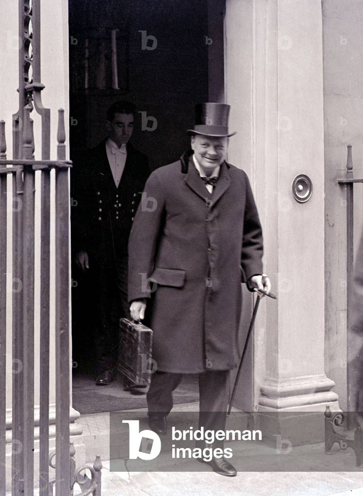 Winston Churchill Leaving No.11 Downing Street with his budget in his dispatch case, April 1925 (b/w photo)