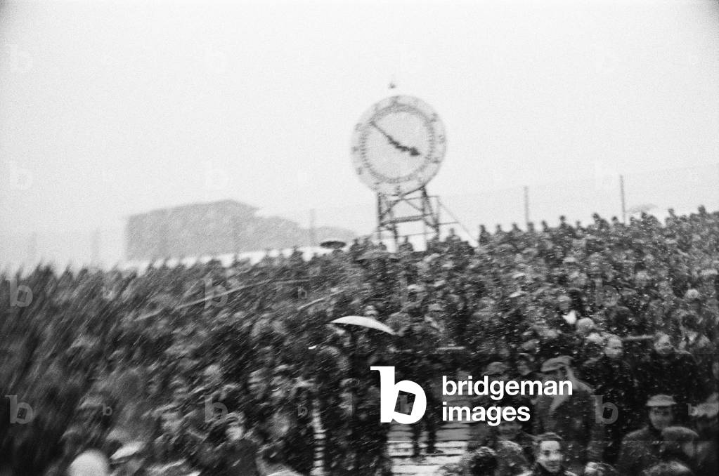 English League Division One match at Highbury, abandoned due to heavy snow. Arsenal v Sheffield Wednesday. Fans on the clock tower stand watch the game. 9th December 1967 (photo)