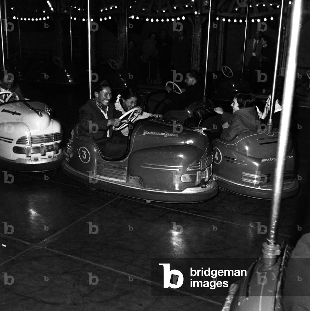 Sherpa Tensing (Tensing Norgay) and daughter Nina seen here at Battersea Pleasure Gardens : Grandmaster and child ride on dodgem cars. July 1953 July 1953 D3557