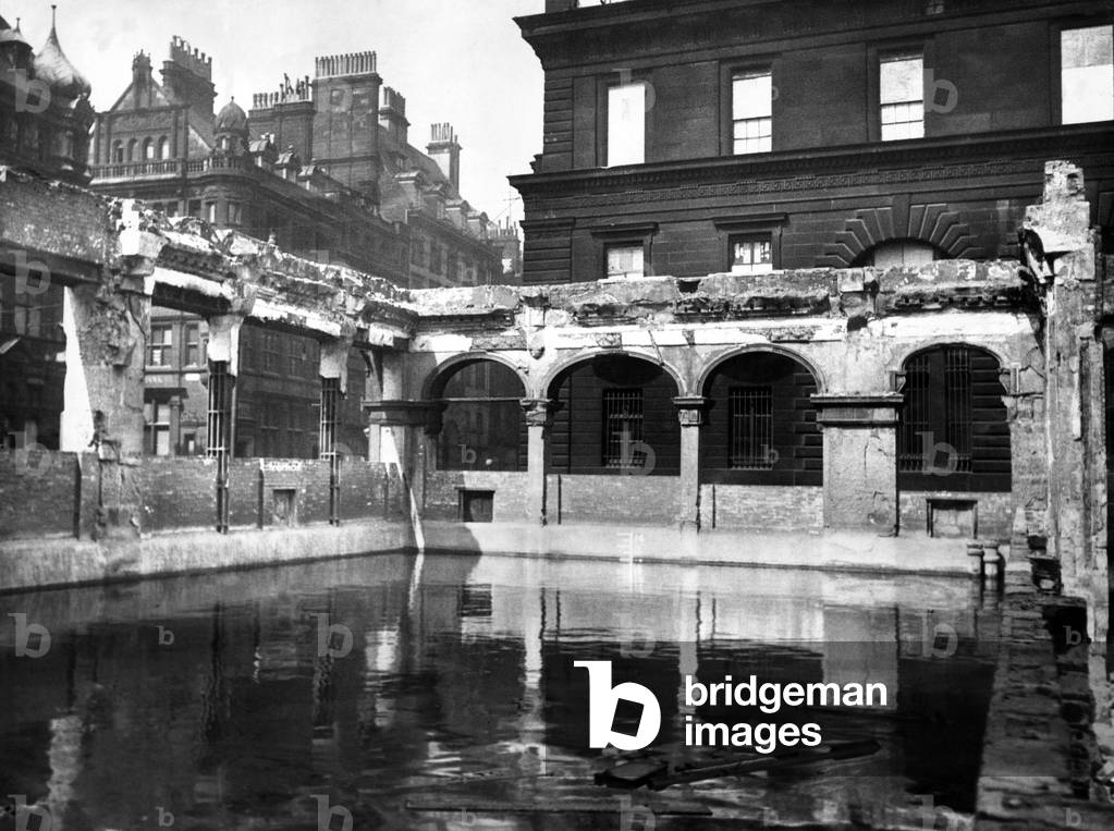 Bomb damage in Liverpool during the Second World War. An emergency water supply reservoir which has been established in the basement of a blitzed building at the corner of Cook Street and Castle street, Liverpool., 20th April 1942 (b/w photo)