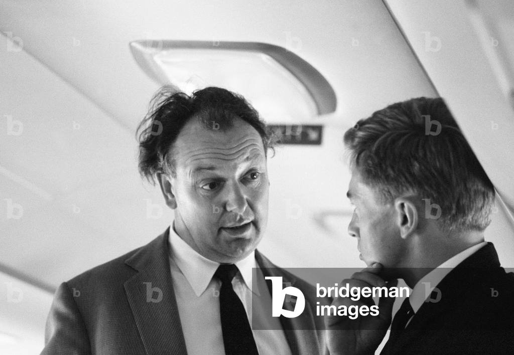 Airline chief Freddie Laker, head of Laker Airways, pictured talking to one of his staff members on board one of his aircraft at Biggin Hill Air Fair.
12th May 1967.