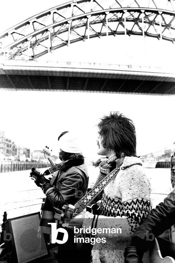 Lindisfarne sailed down the Tyne on a musical journey. The group were filming on board a Tyne ferry for a half-hour television show called 'All Right Now'. Si Cowe and Ray Jackson pictured. 4th March, 1979 (b/w photo)