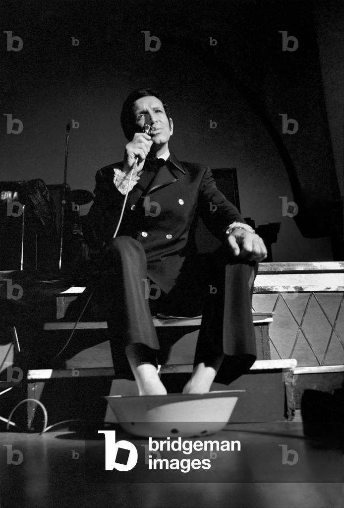 Cabaret artist and Britain's top singing coach Bob Anthony is performing a non-stop singing marathon in aid of charity. After training for 10 years, 18 hours a day, Bob realises his life's ambition and will show the world his modern singing and breathing techniques which hitherto have not been practised by any singer.
With over 15 hours on his feat. Bob Anthony relaxes with his feet in a bowl of water on stage at the Lyceum - still singing. 
November 1969