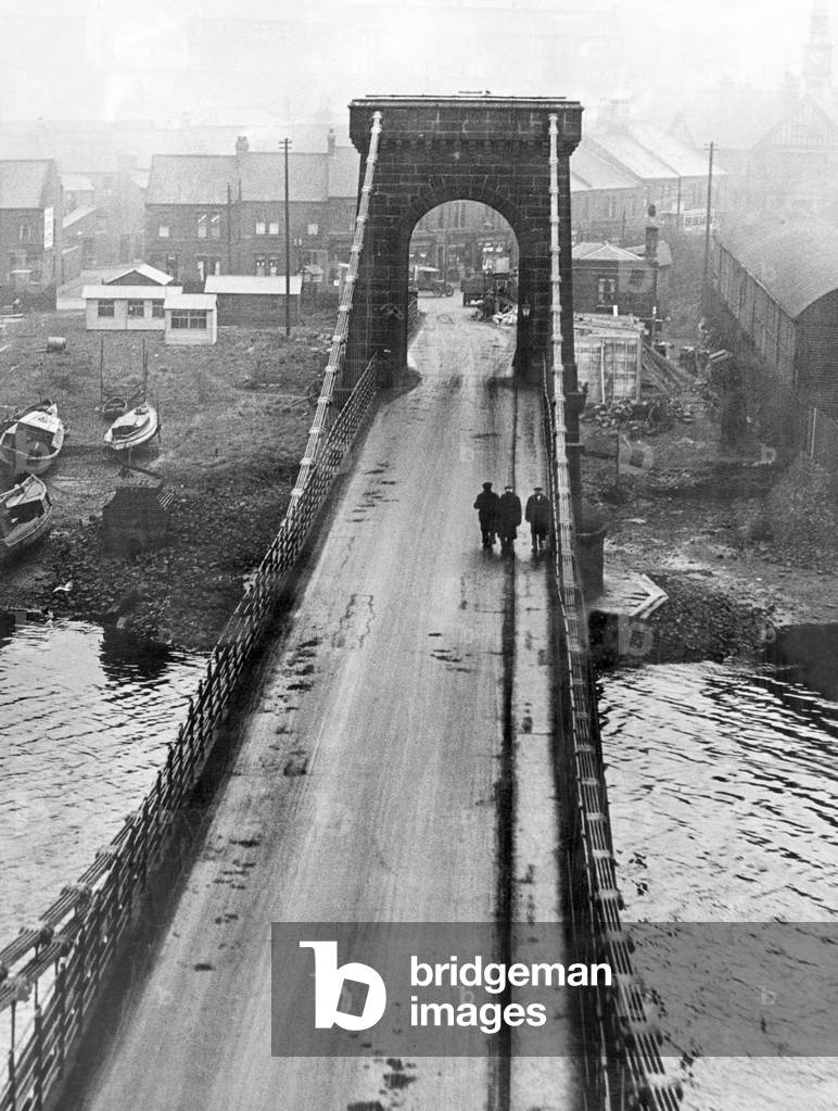 An unusual view of Scotswood Bridge, Newcastle, from one of the towers. Pictured, the bridge before it was widened to meet the needs of present day traffic. 6th December 1930 (b/w photo)