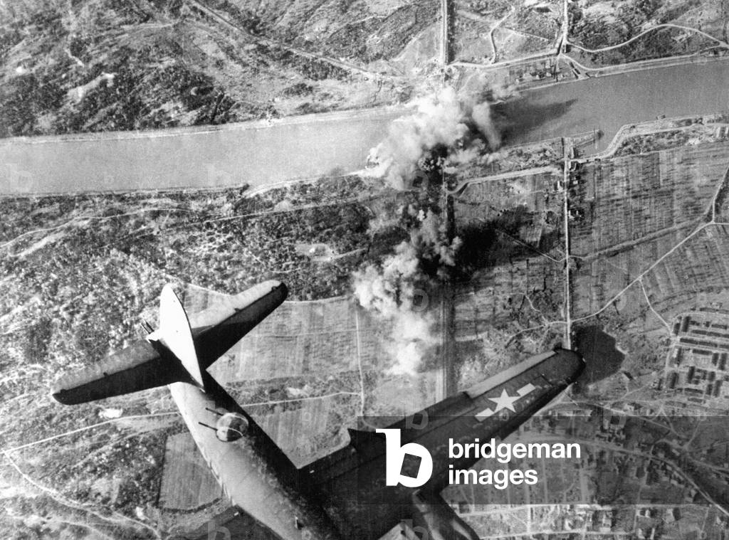 B26 Marauder bomber attacks Nauenberg rail span across the Rhine as the US Seventh Army was driving towards Germany during WW2. December 1944 (b/w photo)