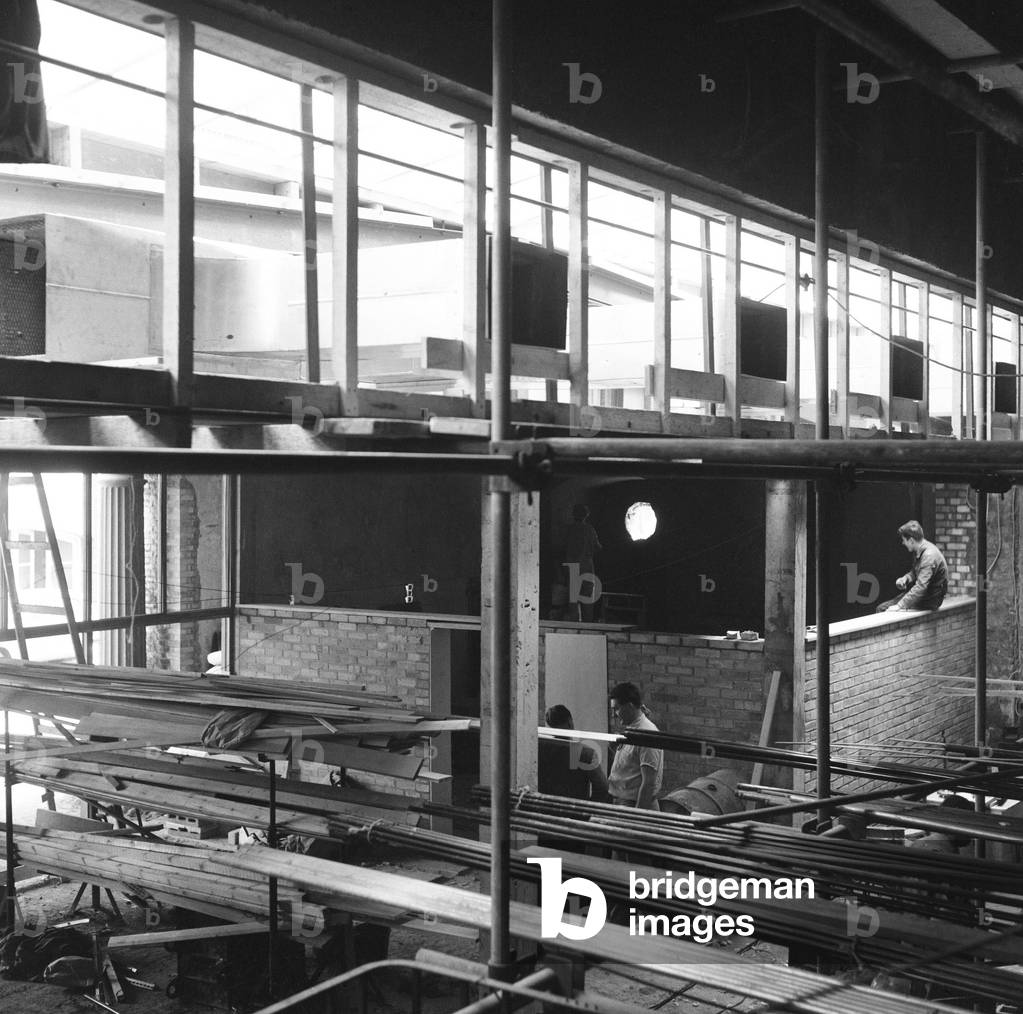 Construction of the new Mermaid Theatre at Puddle Dock, Upper Thames Street in London, opened by actor and director Bernard Miles. 8th May 1959 (b/w photo)