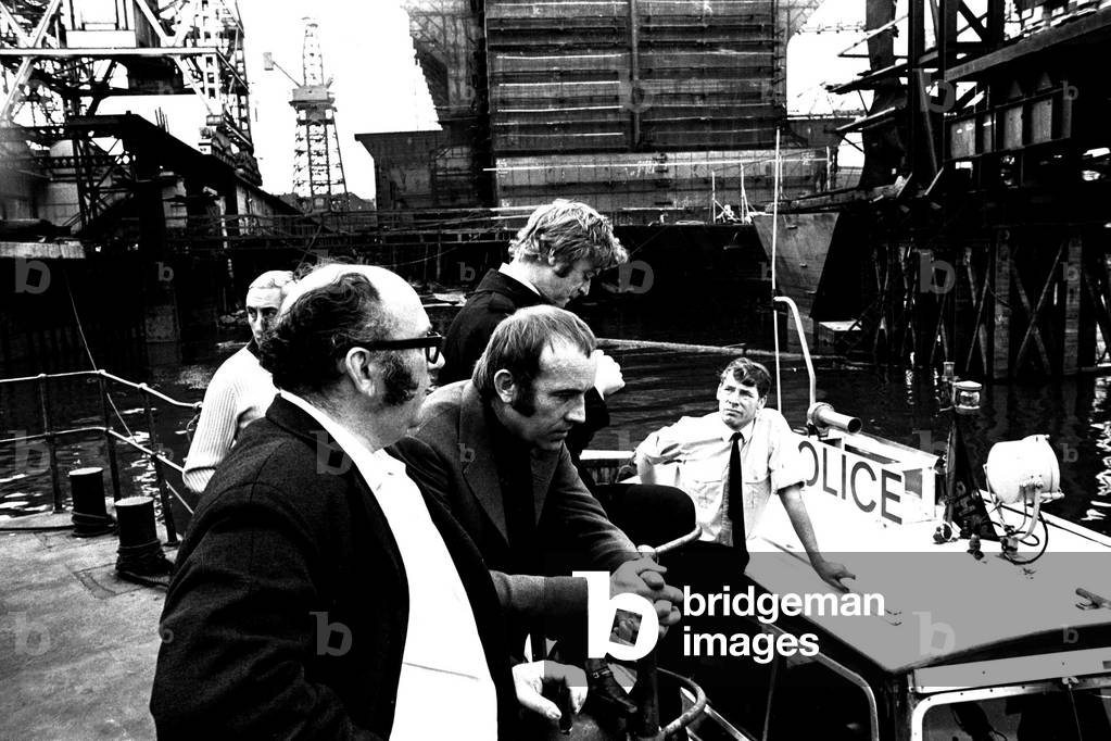 Michael Caine in a scene from the film Get Carter. Hebburn-Wallsend ferry landing with fellow actor Ian Hendry on 1st June 1970 (b/w photo)