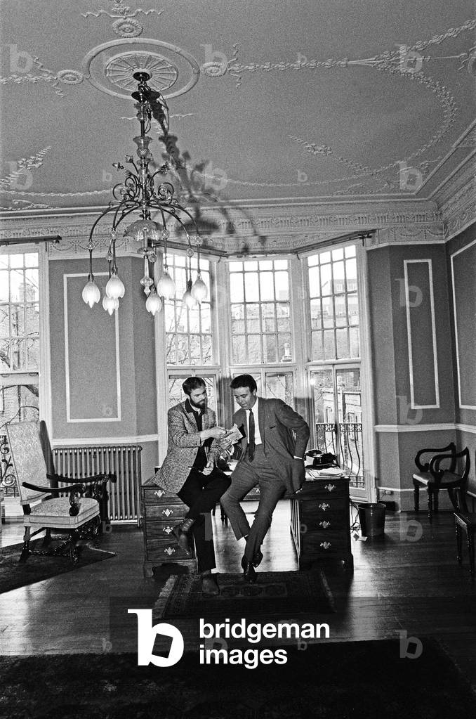 Ray Galton and Alan Simpson on tour for new ideas, and also for possible next Steptoe series. Pictured here at their palatial offices. 30th April 1964 (b/w photo)