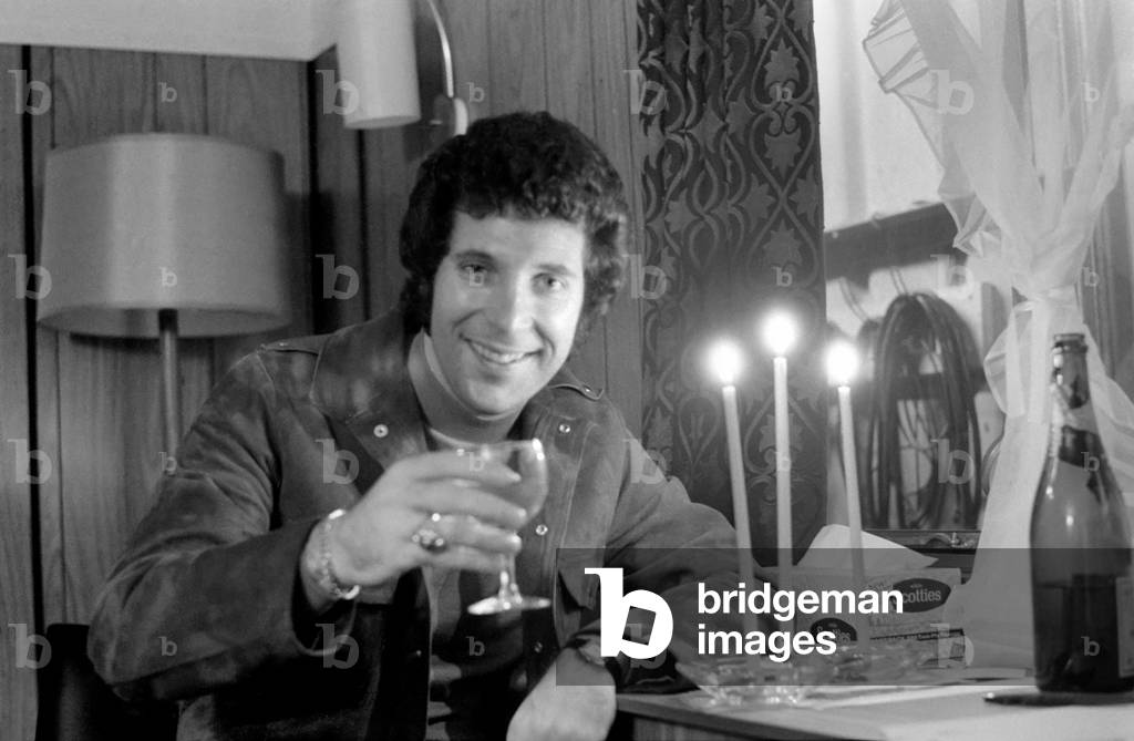 Tom Jones: Candlelight in his Caravan at Elstree during a break in rehearsals, Tom Jones toasts the share holders of Mam. December 1970