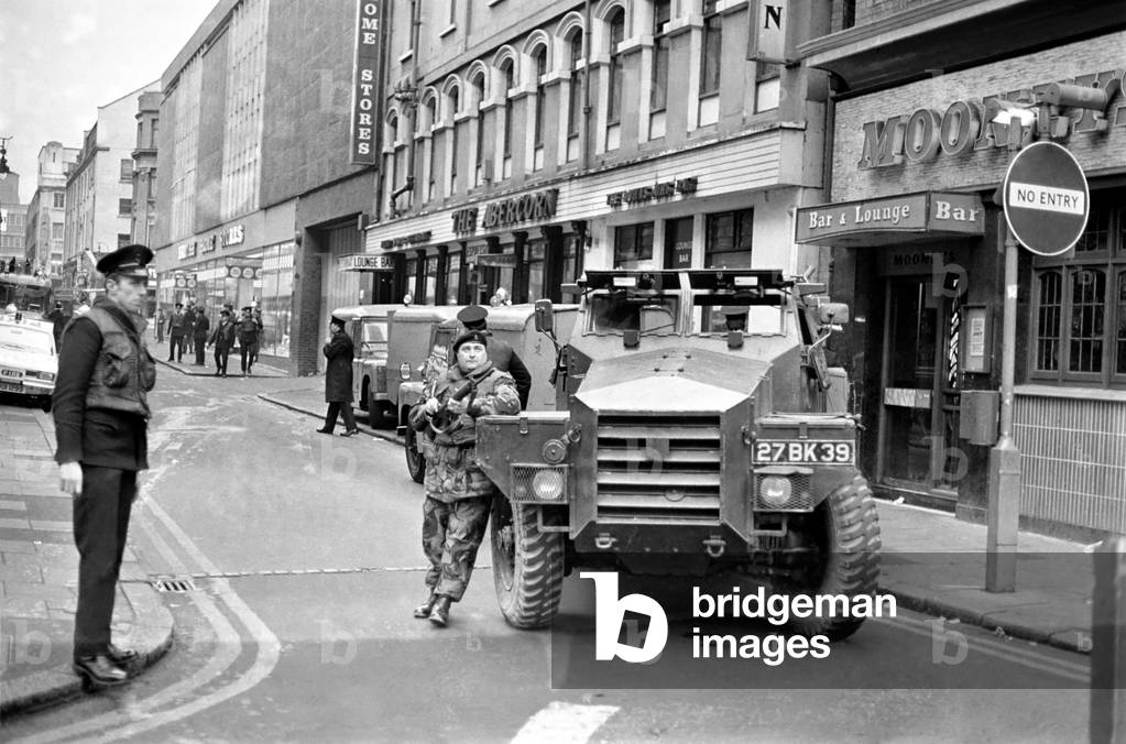 Police and army at, the scene of a lorry bomb containing sherry bottles in Callander St. Belfast. January 1972 72-541-003
