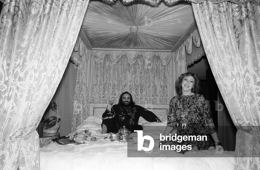Demis Roussos November 1977 Perched on his mink covered bed which cost 30,000 wearing Kaftan with Wife Dominique