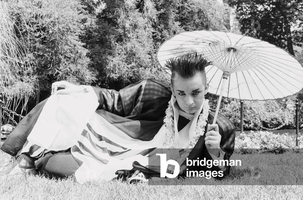 Culture Club singer Boy George poses outdoors in the garden, August 1985.