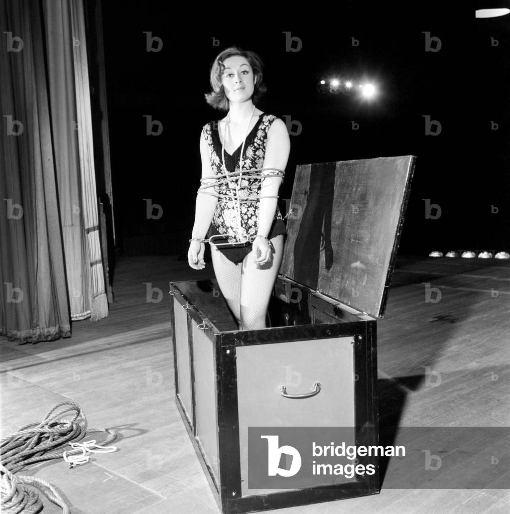Woman escapologist Jill Fletcher, 1965 (b/w photo)