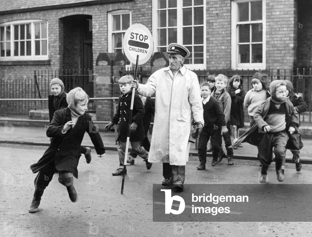 Mr Thomas Gowland lollipop man - crossing warden at Bloemfontein County school, circa 01/06/1975 (b/w photo)
